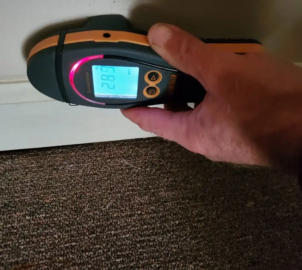 Moisture detection at baseboard during Storm Damage Restoration in Aptos